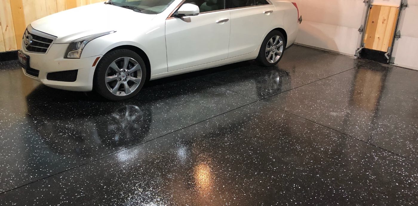 white car parked in garage with epoxy floor